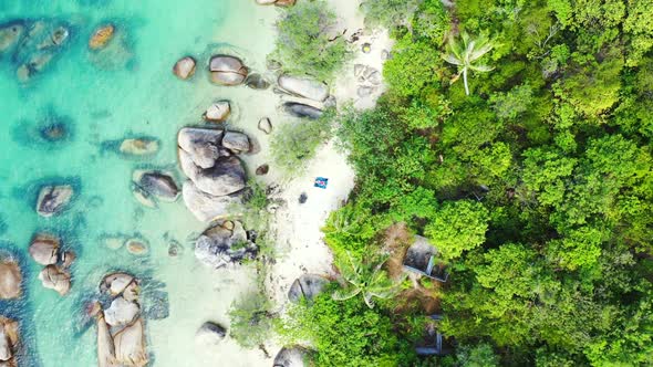 Aerial above landscape of beautiful lagoon beach trip by blue green ocean with white sand background