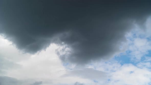 4k Dark gray storm clouds time lapse. Dramatic sky.