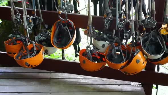 Climbing Gear Equipment  Orange Helmet Hanging on a Board