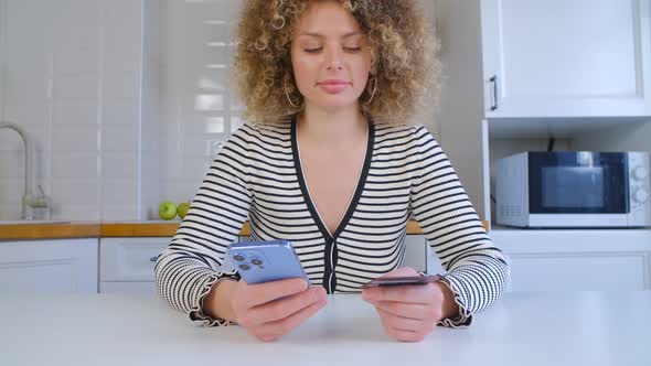 Woman buying online with bank card and smartphone app in 4k stock video