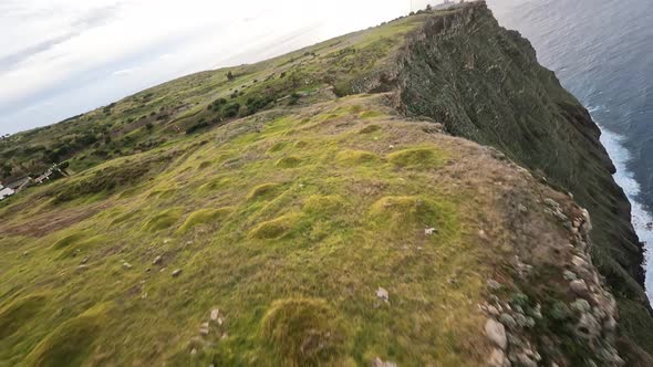 FPV Racing Drone Mountain Surfing and Cliff Diving Along the Rocks