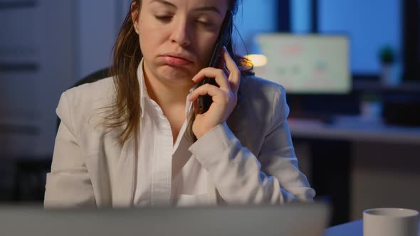 Concentrated Businesswoman During Phone Call Late at Night