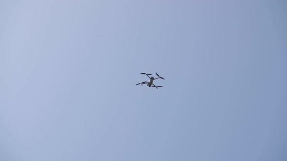 a small quadcopter in the sky