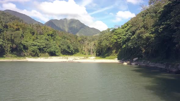 Aerial Landscape Green Mountain and Tropical Trees on Lake Shore. Tropical Trees and Plants on Lake