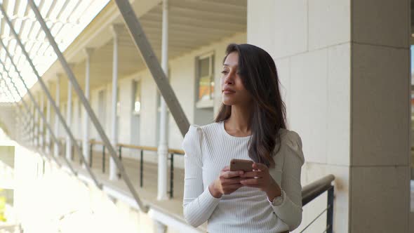 Slow motion shot of Indian woman using smartphone