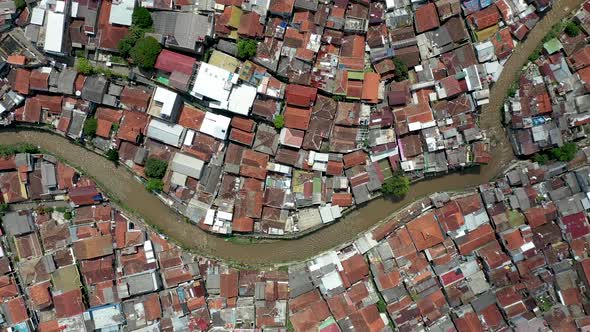 Residential water canal in Bandung city near Pasupati bridge, West Java Indonesia, Aerial pan right