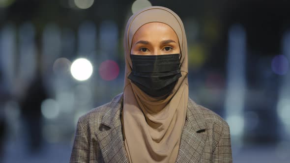 Closeup Islamic Female in Medical Mask Posing in Night City