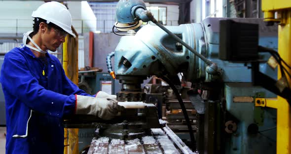 Male engineer working on a machine 4k alt