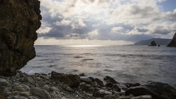 Time Lapse of a rugged rocky coastline with dramatic sky on Wild Atlantic Way in Ireland.