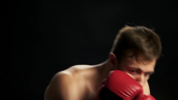 Shirtless Kick Boxer Showing His Punches.