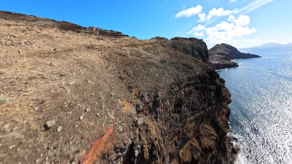 FPV Racing Drone Mountain Surfing and Cliff Diving Along the Rocks