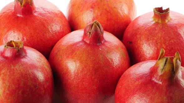 A Lot of Ripe Red Whole Pomegranates. Rotating