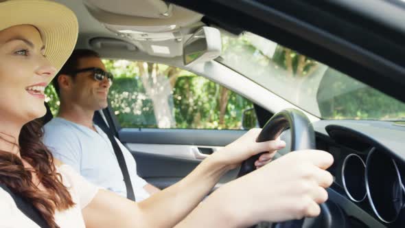 Couple together in a car on road trip