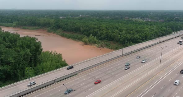 Aerial of cars on 59 South as the pass over the Brazos River in Sugarland, Texas.