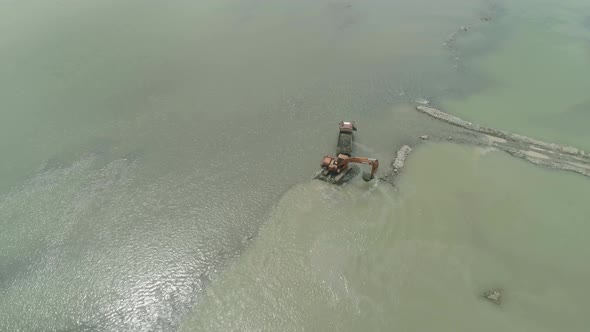 Cleaning and Deepening By a Dredger on the River. Philippines, Luzon