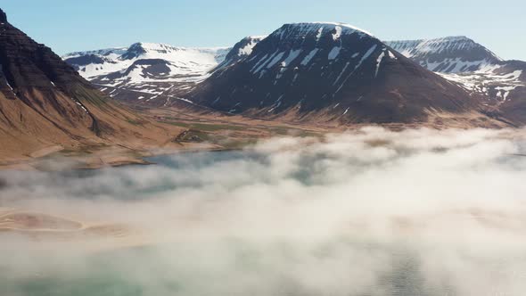 Drone Over Misty Fjord And Mountains