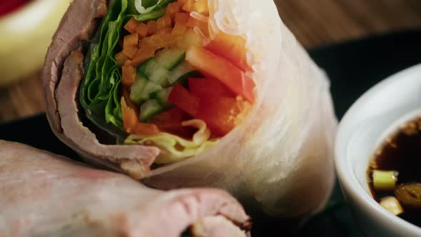 Spring Roll with Chicken or Shrimps in Rice Paper with Sweet and Sour Sauce Closeup Cooking