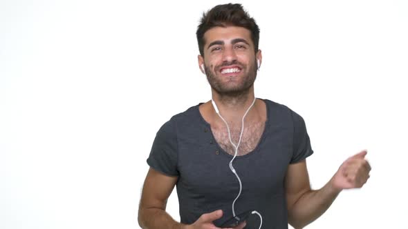 Slomo Hispanic Happy Energetic Guy Emotionaly Listening to Favourite Music Dancing Shouting Smiling