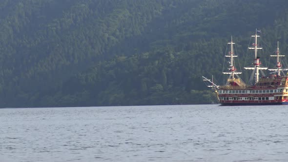 Timelapse, Close-up, The view of traditional japanese ship enters right to the picture in Ashi lake