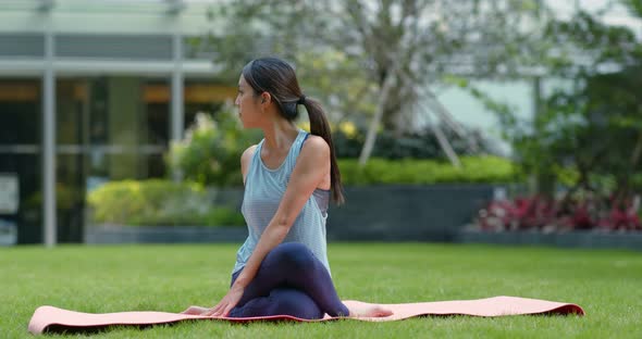 Woman do yoga at the park