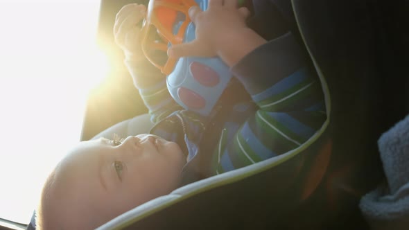 Toddler Boy Traveling in a Car Sitting in a Child Safety Seat