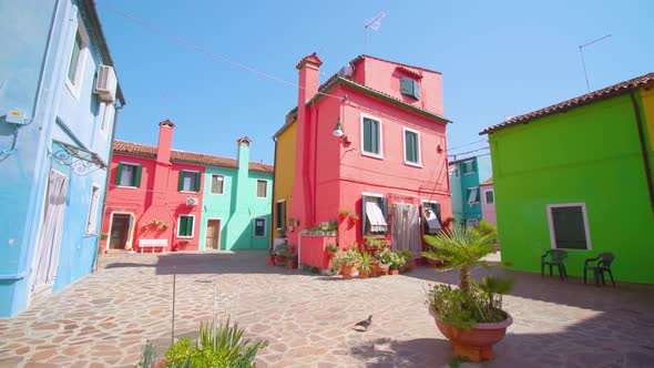 Burano Yard with Colorful Houses Under Cloudless Sky