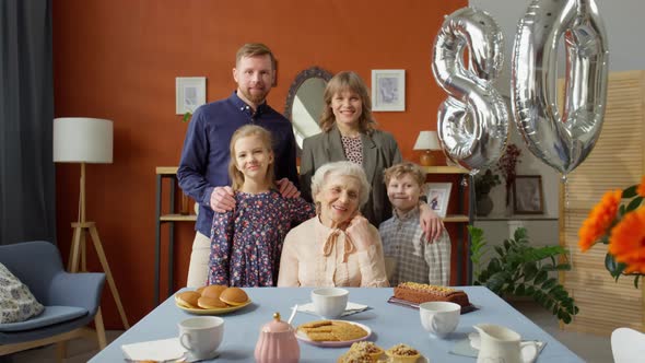 Portrait of Happy Family at Grandma Birthday Dinner