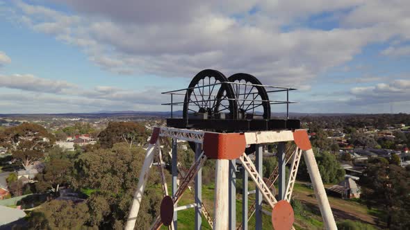 Close-up circling drone shot of Victoria Hill Mining Reserve poppet head in Bendigo