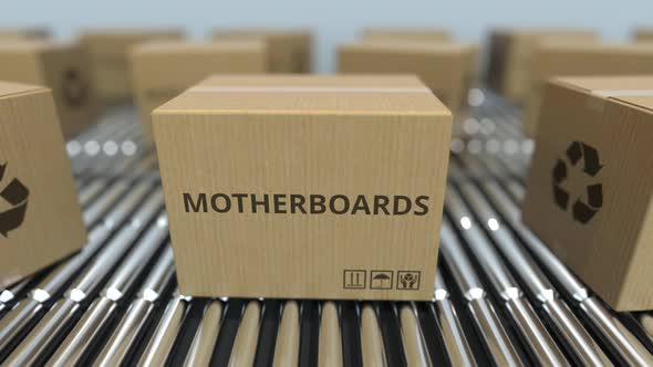 Cartons with Computer Motherboards on Roller Conveyors