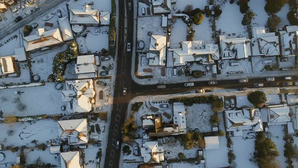 Snowy Streets and Houses in the Early Morning Bird's Eye View