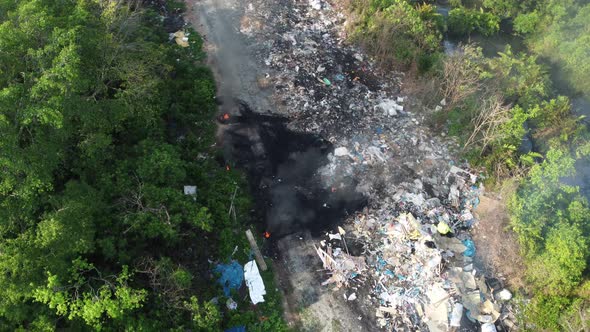 Aerial view open burn of rubbish near rural.