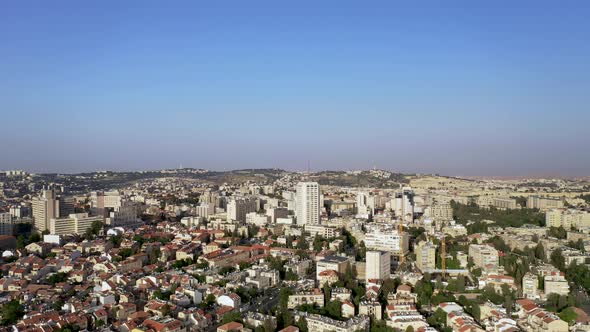 Warm saturated Aerial high view of Jerusalem urban city center, Panorama rotating shot