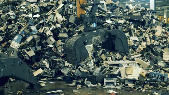 Working Machine Grabs Plastic Litter To Recycle.