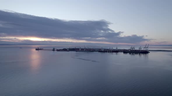 Aerial sunset seascape of Canada Vancouver Tsawwassen BC ferry public service transportation, drone