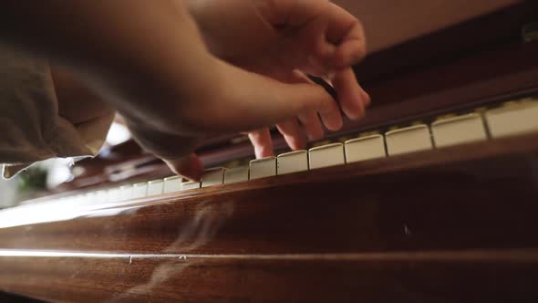 Woman Playing on Vintage Wooden Piano