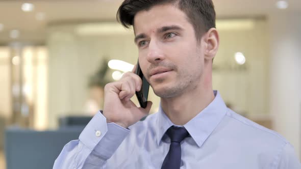 Businessman Talking on Phone