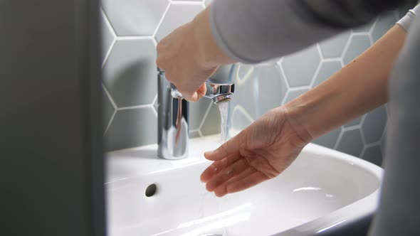 Close Up of Woman Washing Hands with Water