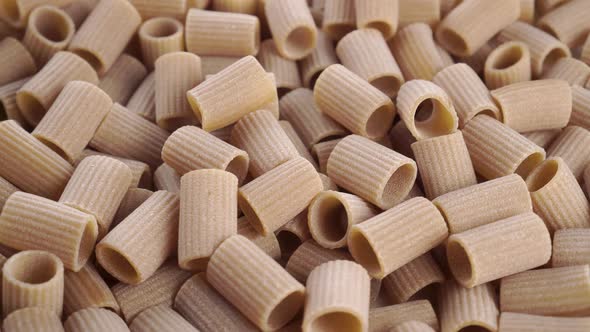 Dry rigatoni uncooked italian pasta close up