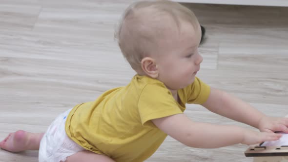 Child Having Fun Playing with Wooden Busy Board Happy Kid Play with Educational Learning Toy Enjoy