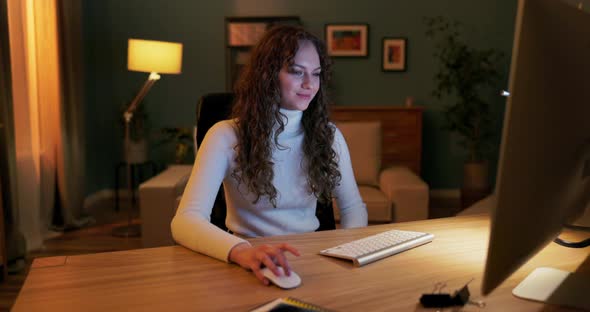 A Teenager Spends Evenings in Front of the Computer Scrolling Through Websites Scrolling Through