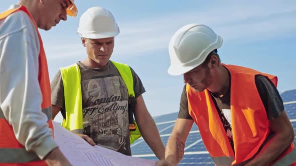 Engineer of solar plant reading the plan