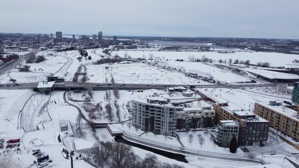 Aerial View Of Snow-covered Landscape In The City Of Ottawa In Canada With Traffic On Highway At Win