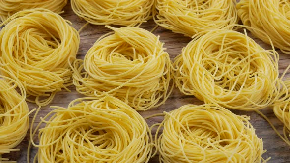 Italian rolled fresh fettuccine pasta. Spaghetti Tagliatelle nests