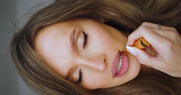 Closeup View of a Woman Paint Lips