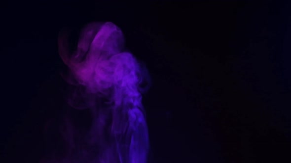 Slow motion of white smoke, fog, mist, vapor on a black background.