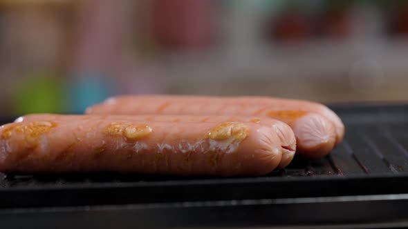 Meat Sausages Are Fried On Grill