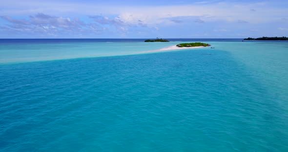 Natural birds eye travel shot of a summer white paradise sand beach and blue water background in colourful