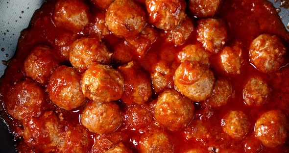 Meatballs Are Fried in a Pan. A Slow Rotation. 