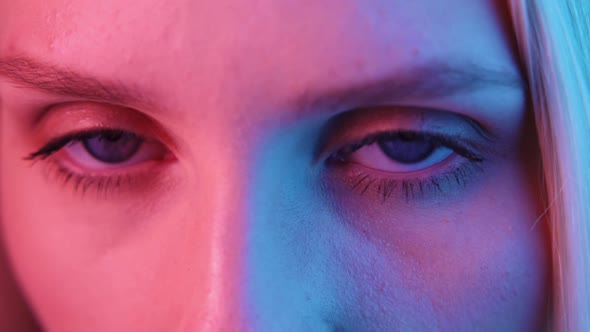 Extreme Close Up of Human Eye Iris Under Neon Light