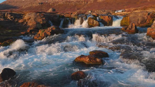 River and Cascades of Dynjandi Falls at Sunset Westfjords Iceland